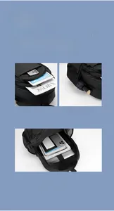 Detail view of large capacity black backpack showing multiple storage compartments and pockets