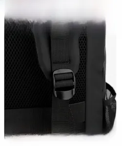 Detail of adjustable buckle and breathable honeycomb mesh padding on the black laptop backpack