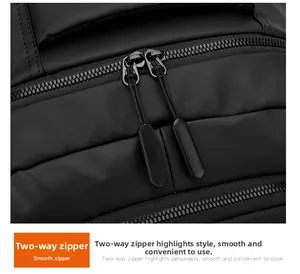 Detail view of durable dual-way zippers and waterproof fabric on a black laptop backpack