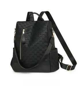 Micro side display of black anti-theft backpack with textured weave and gold zippers