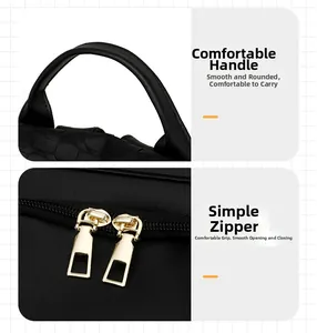 Detail of woven handle and double gold zippers on black anti-theft leather backpack