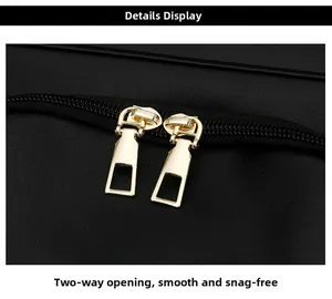 Detail of smooth two-way metal zippers on a black water-resistant travel backpack