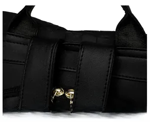 Macro detail of black leather backpack showing neat stitching and golden metal zipper