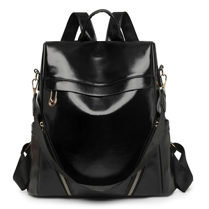 Glossy black PU leather backpack with minimalist fold-over flap and pleated front detail