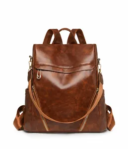 Detailed front view of dark brown PU leather backpack with vintage lychee texture