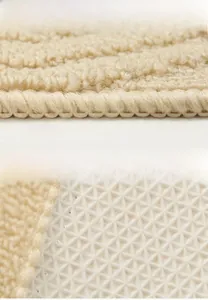 Detail of cream doormat featuring reinforced stitched edges and anti-slip rubber backing