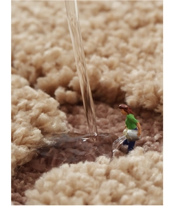 Macro detail of the thick khaki moss rug showing soft texture and high water absorption