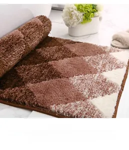 Macro shot of thick brown and beige gradient flocking bath mat showing dense pile texture