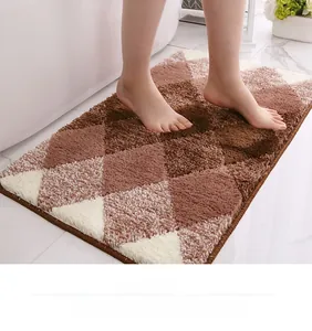 Close-up of thick gradient flocked bath mat with non-slip texture and geometric pattern