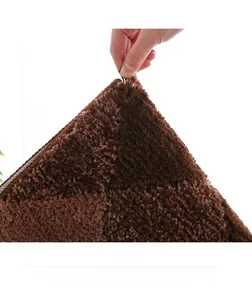 Detailed close-up of dark brown plush rug featuring thick high-density soft fibers