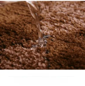Macro detail of dark brown microfiber mat showing strong water absorption and quick dry fiber