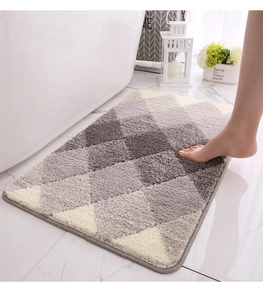 Close-up of soft gradient flocking bath mat with grey geometric diamond pattern texture