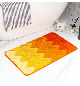 Detailweergave van de zachte gevlokte textuur en het geometrische zigzagpatroon van de mat