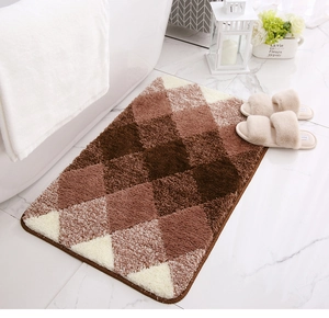 Macro view of brown diamond pattern plush bath mat showing soft shaggy texture