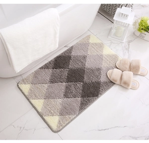 Detail of high-density flocked bath mat with non-slip backing and gradient rhombus pattern