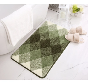 Close-up of fluffy green argyle pattern bath mat with high-density plush texture