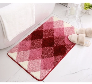 Macro view of plush pink diamond pattern bath mat with thick anti-slip flocking texture