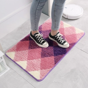 Plush gradient diamond pattern bath mat with non-slip backing for indoor home use