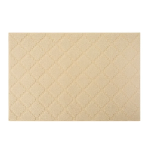 Cream rectangular entryway mat with embossed four-leaf clover pattern on a white backdrop