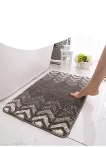 Macro shot of absorbent grey gradient bath mat showing soft flocked plush texture