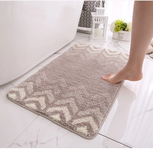 Close-up of thick absorbent flocking mat with beige and taupe herringbone pattern