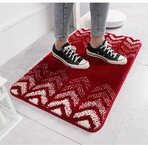 Close-up of red and white chevron flocked rug with absorbent non-slip texture