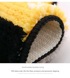 Detail of soft flocked rug showing thick yellow plush pile and anti-slip TPR latex backing
