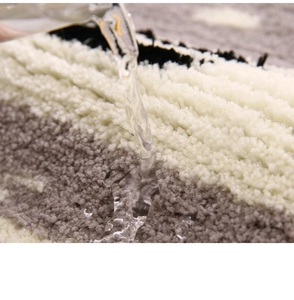 Macro shot of striped plush absorbent rug showing water filtration on thick fibers