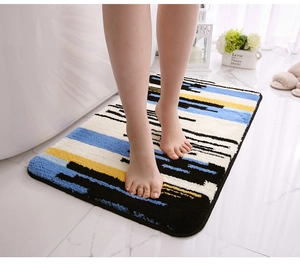 Detailed view of thick flocked bathroom mat with geometric stripes on marble floor
