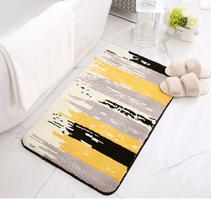 Detail of thickened flocking rug with modern abstract color block pattern and non-slip edge
