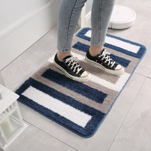 Absorbent striped bath mat in navy blue and grey fluffy plush for home safety