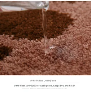 Close-up of brown microfiber bath mat showing high water absorption and soft texture