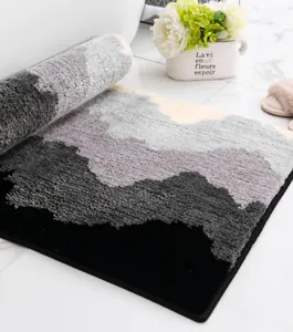 Close-up detail of dense plush bathroom mat showing thick mountain pattern texture