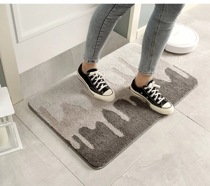 Detailed close-up of thickened gray wave pattern bath mat with anti-slip texture