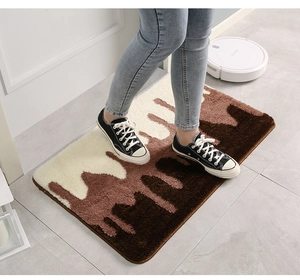 Detailed close-up of thickened non-slip indoor rug with brown abstract lava flow pattern
