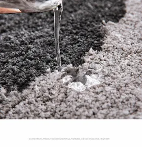 Macro shot of microfiber bath mat showing high water absorption and deep grey texture