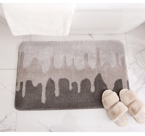 Macro detail of plush absorbent bath mat featuring artistic grey gradient texture