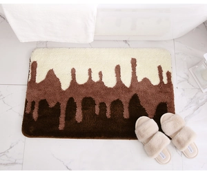 Detailed close-up of thick absorbent bath mat with brown melting chocolate drip pattern