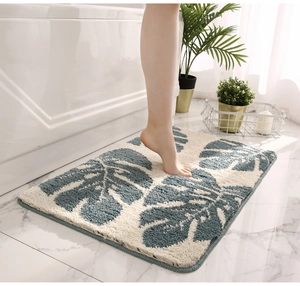 Close-up of fluffy Monstera leaf pattern bath mat with high-density fiber and non-slip edge