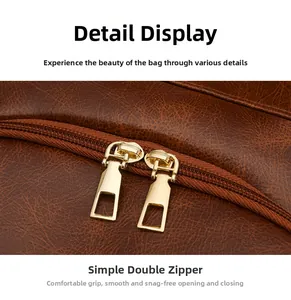 Detailed close-up of premium vintage brown leather texture and dual gold metal zippers