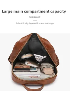 Top view showing the spacious main compartment of the brown faux leather backpack