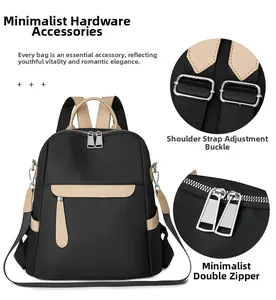 Detail of premium silver metal buckles and smooth double zippers on black oxford backpack