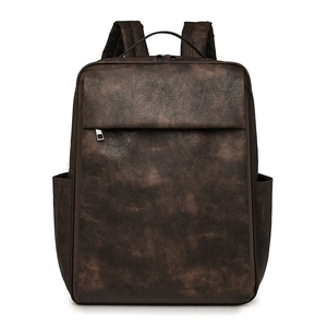 Front view of a vintage dark brown PU leather backpack with a matte textured finish