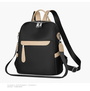 Detail of oxford fabric texture, premium leather handles and dual zippers on a large backpack