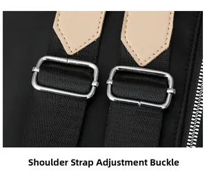 Detail of adjustable nylon shoulder straps with silver metal buckles on a black travel backpack