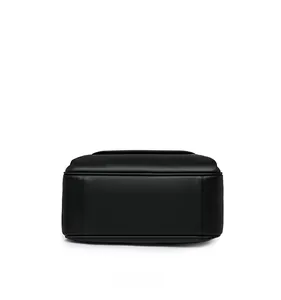 Bottom view of black PU leather backpack showing clean stitching and smooth texture