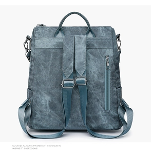 Detail of dark blue backpack with vintage marble texture and back zipper pocket