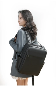Business backpack with ergonomic wide straps and side pocket shown on female model