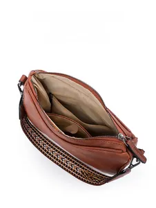 Detail view of brown leather bag interior with main pocket, slip pocket and zip pocket