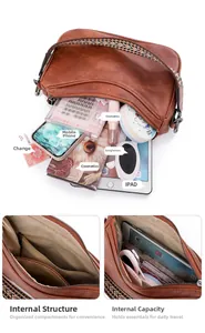 Internal compartments and storage capacity of brown faux leather crescent shoulder bag